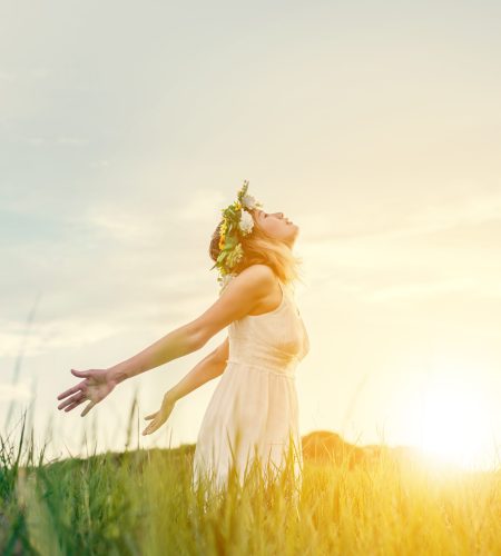 Freedom concept : Young beautiful woman enjoying with fresh air at meadows